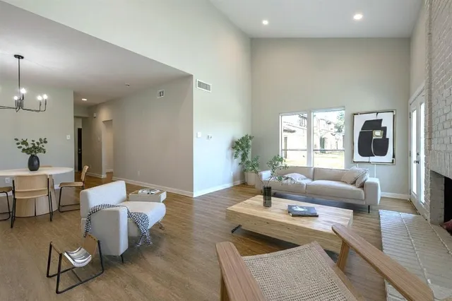 a living room with furniture and a table