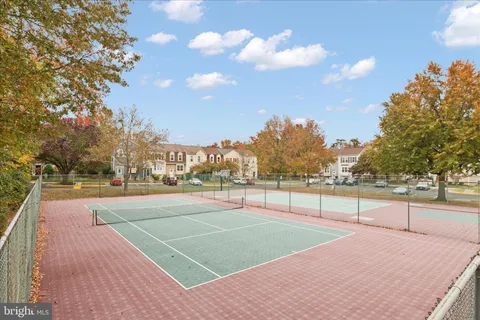 a view of an outdoor space and tennis court