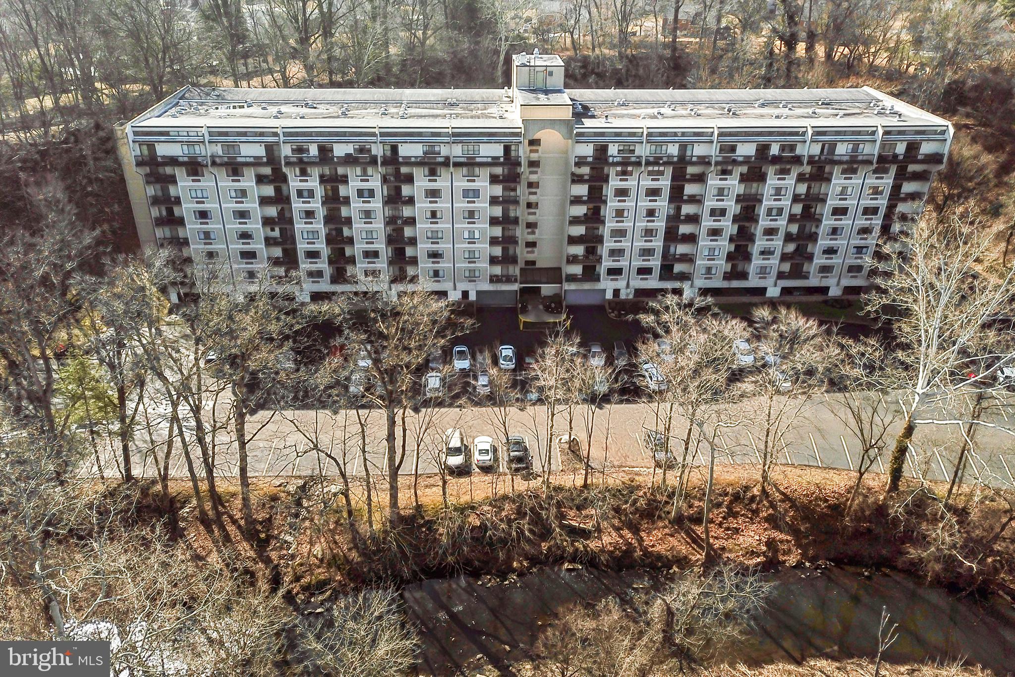 800 Avondale Road, Unit 6J Wallingford, PA 19086 - Photo 1 of 28 Modern apartment complex by a serene creek.