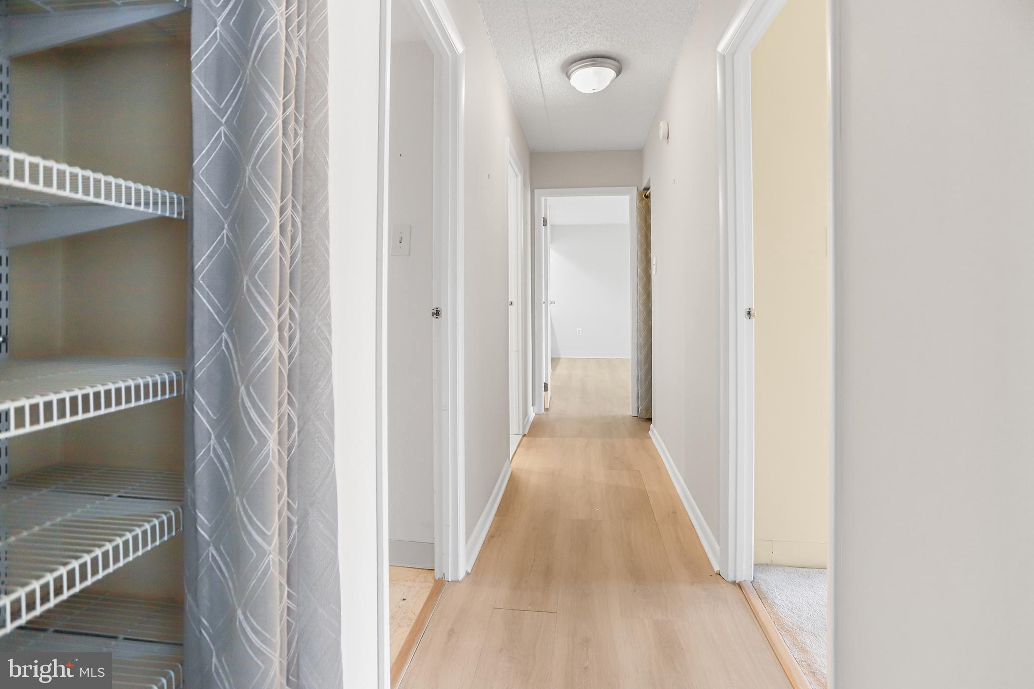 800 Avondale Road, Unit 6J Wallingford, PA 19086 - Photo 13 of 28 Bright and inviting hallway with modern finishes.