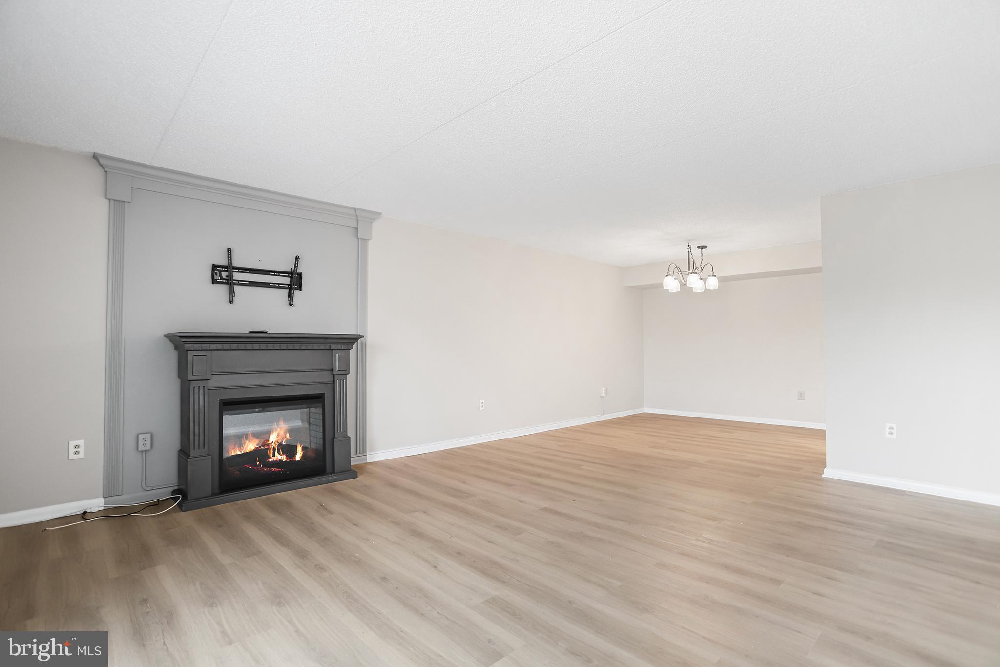 800 Avondale Road, Unit 6J Wallingford, PA 19086 - Photo 6 of 28 Spacious living area with cozy fireplace.