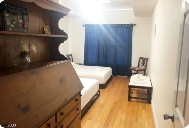a bedroom with a bed and a lamp