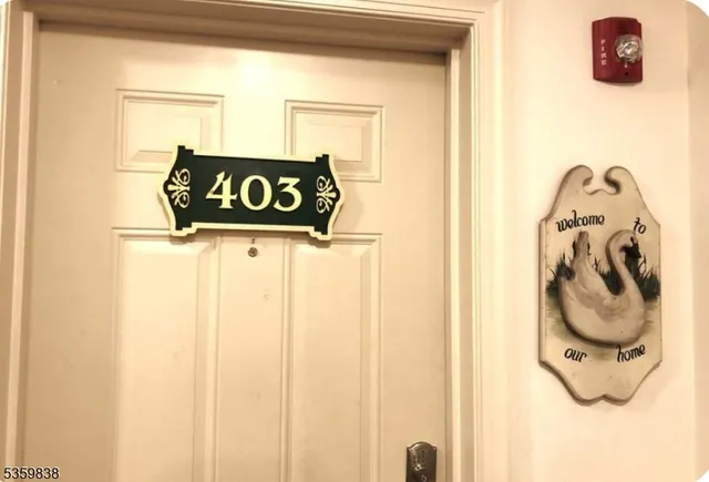 a view of a door and a street sign