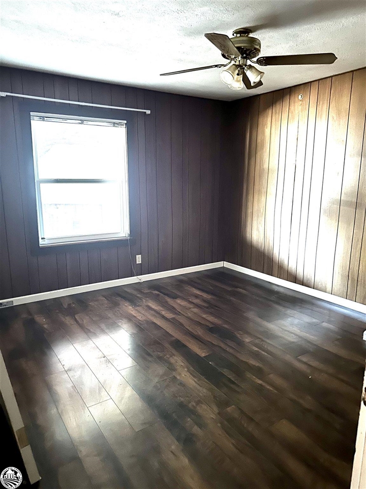 330 Higdon Road West Point, CA 95255 - Photo 13 of 31 an empty room with wooden floor fan and windows