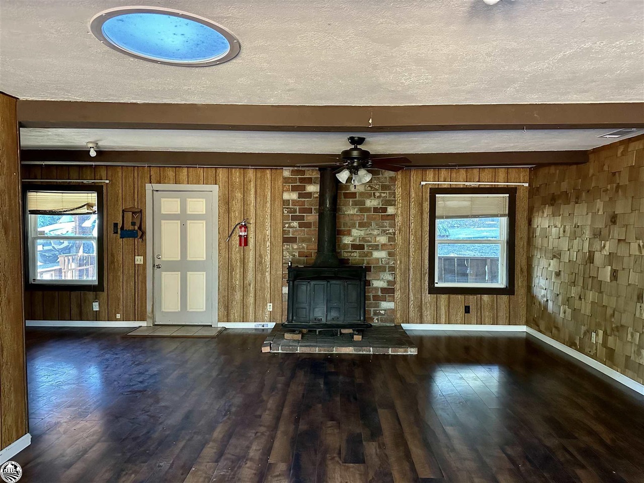330 Higdon Road West Point, CA 95255 - Photo 4 of 31 an empty room with wooden floor and windows