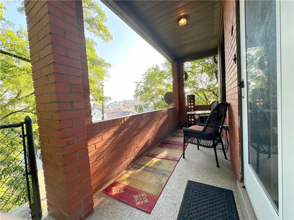 341 Kramer Way Pittsburgh, PA 15211 - Photo 3 of 37 This property combines the convenience of city living with the tranquility of a hillside retreat, making it an ideal home for those who appreciate both modern living and historic charm. It offers this charming front porch, which is 16 feet in length and 5 feet in depth, attached to an all-brick home which enables low maintanance and extremely low utility costs!