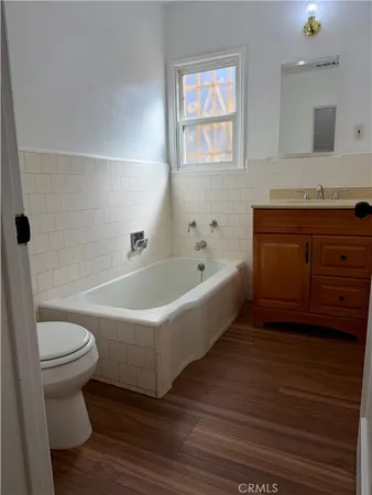 a bathroom with a bathtub and a toilet