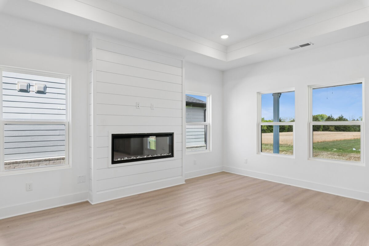 108 Hamilton Lane Lebanon, TN 37087 - Photo 12 of 40 a view of an empty room with wooden floor and a window