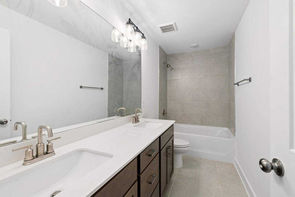 108 Hamilton Lane Lebanon, TN 37087 - Photo 30 of 40 a bathroom with a sink a toilet a mirror and shower