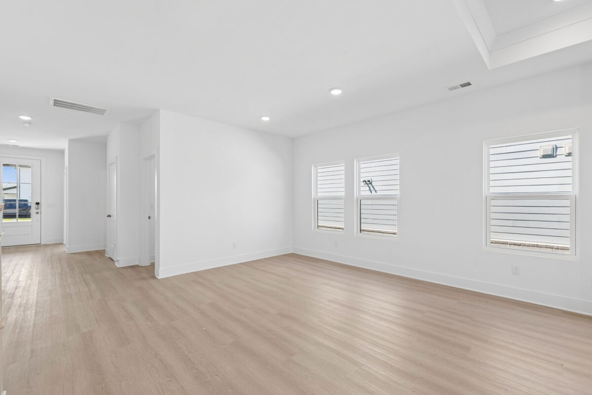 108 Hamilton Lane Lebanon, TN 37087 - Photo 10 of 40 an empty room with wooden floor and windows