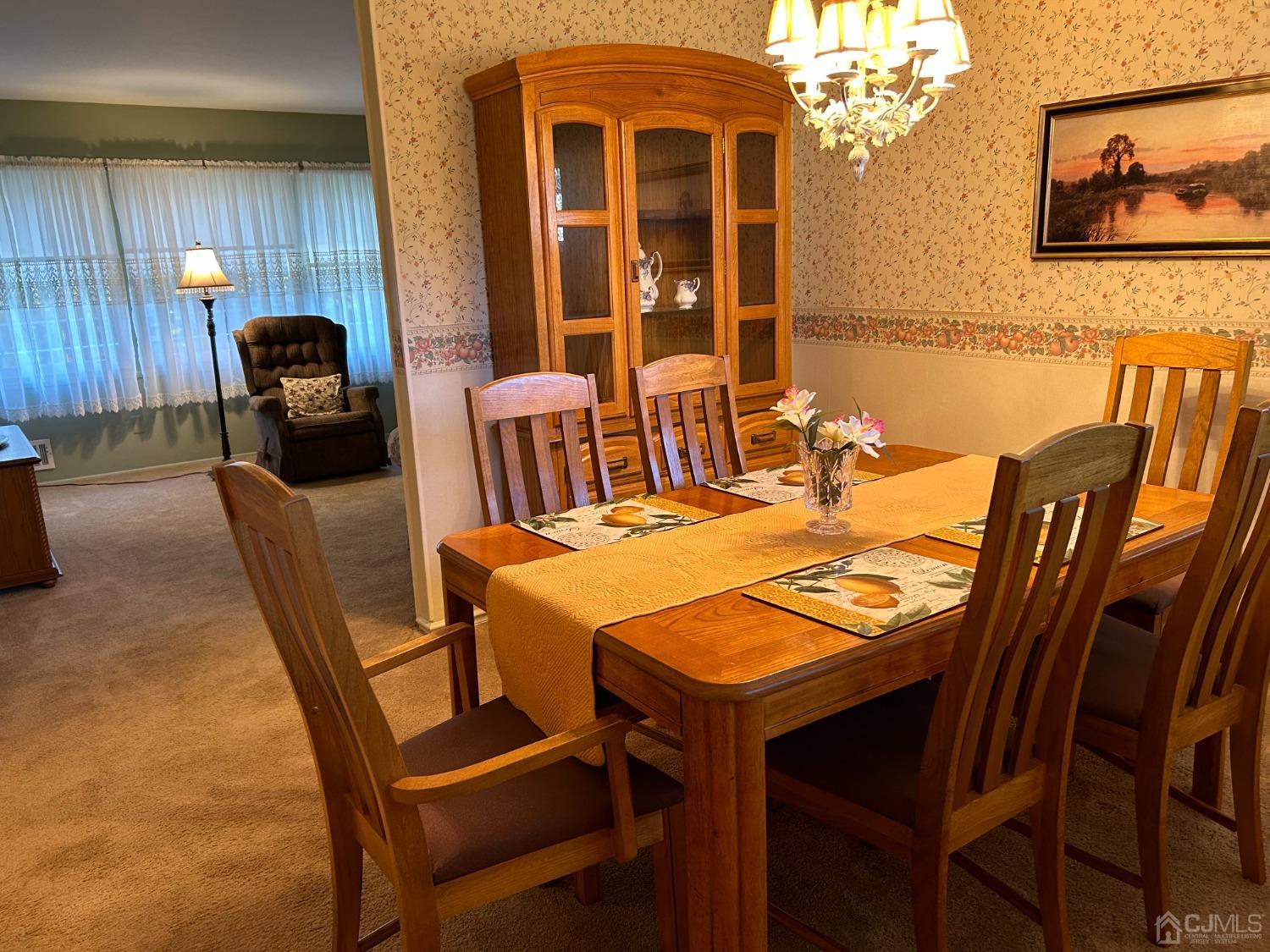 182 Princeton Road Old Bridge, NJ 08859 - Photo 3 of 19 a view of a dining room with furniture and chandelier
