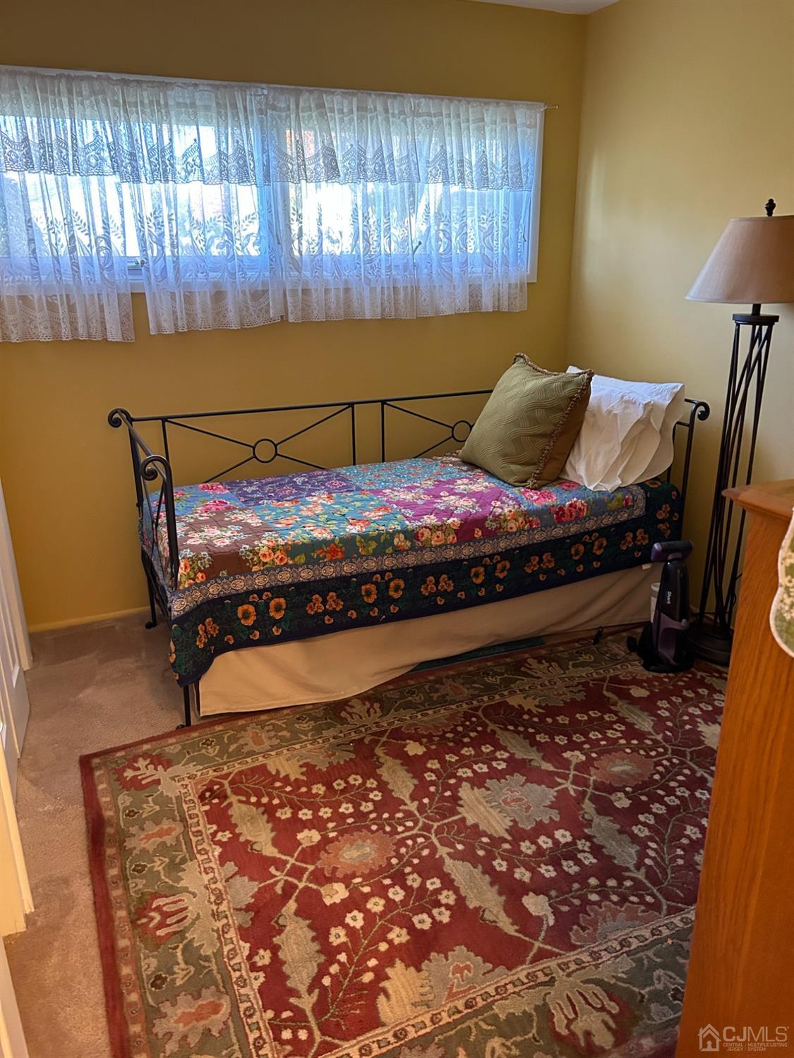 182 Princeton Road Old Bridge, NJ 08859 - Photo 10 of 19 a bed sitting in a bedroom next to a window