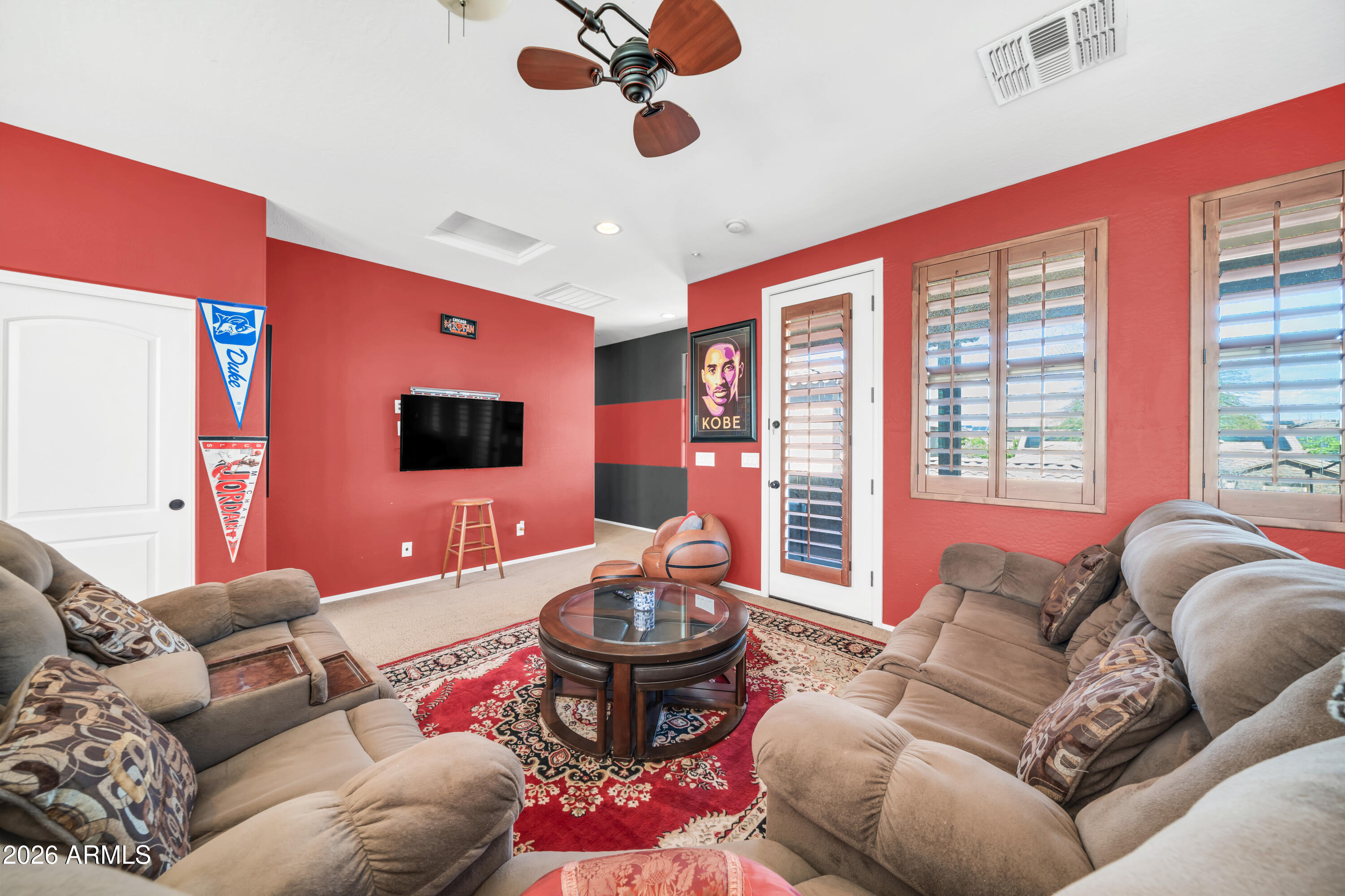 15327 West Roma Avenue Goodyear, AZ 85395 - Photo 9 of 65 a living room with furniture or couch and a large window