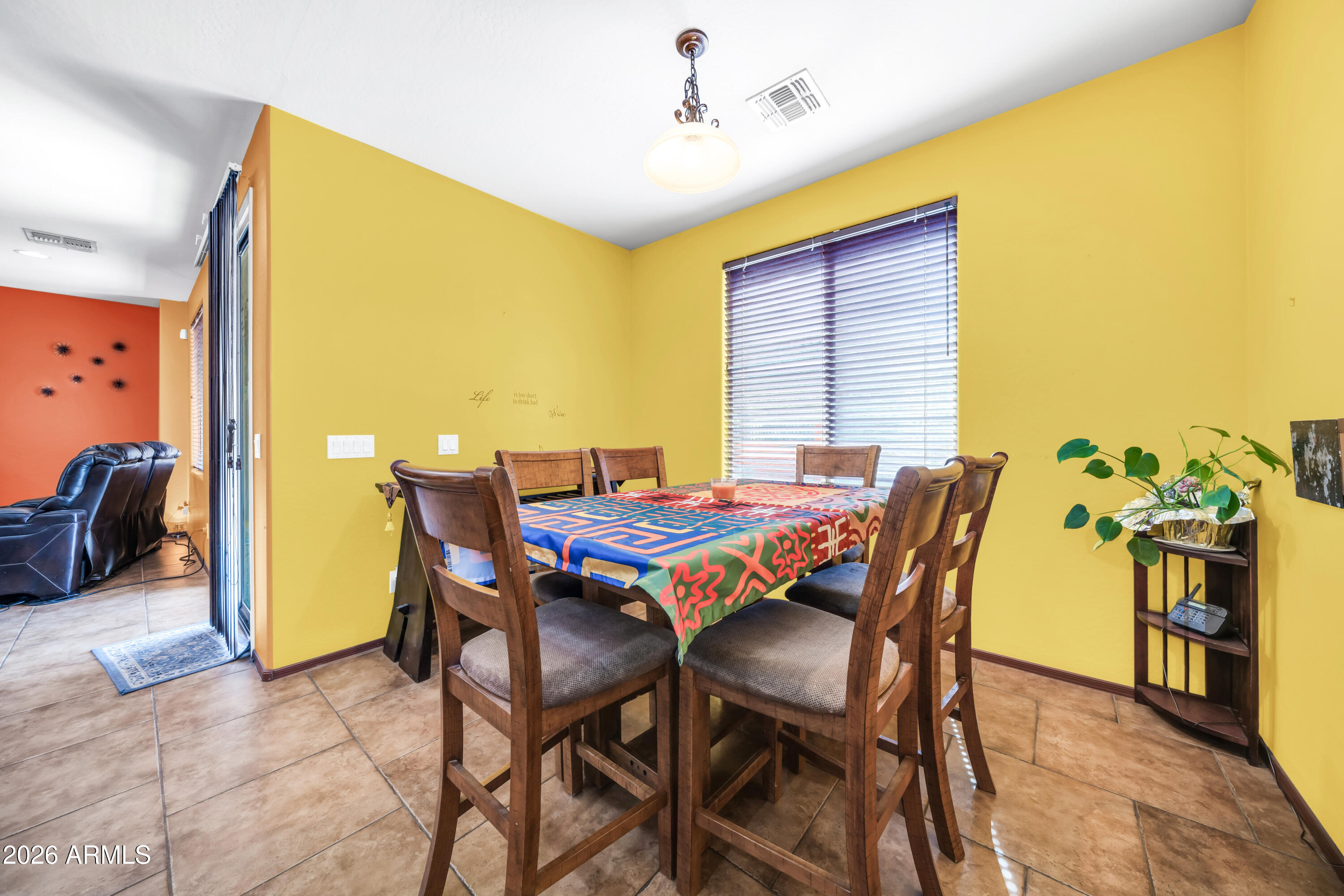15327 West Roma Avenue Goodyear, AZ 85395 - Photo 12 of 65 a view of a dining room and livingroom