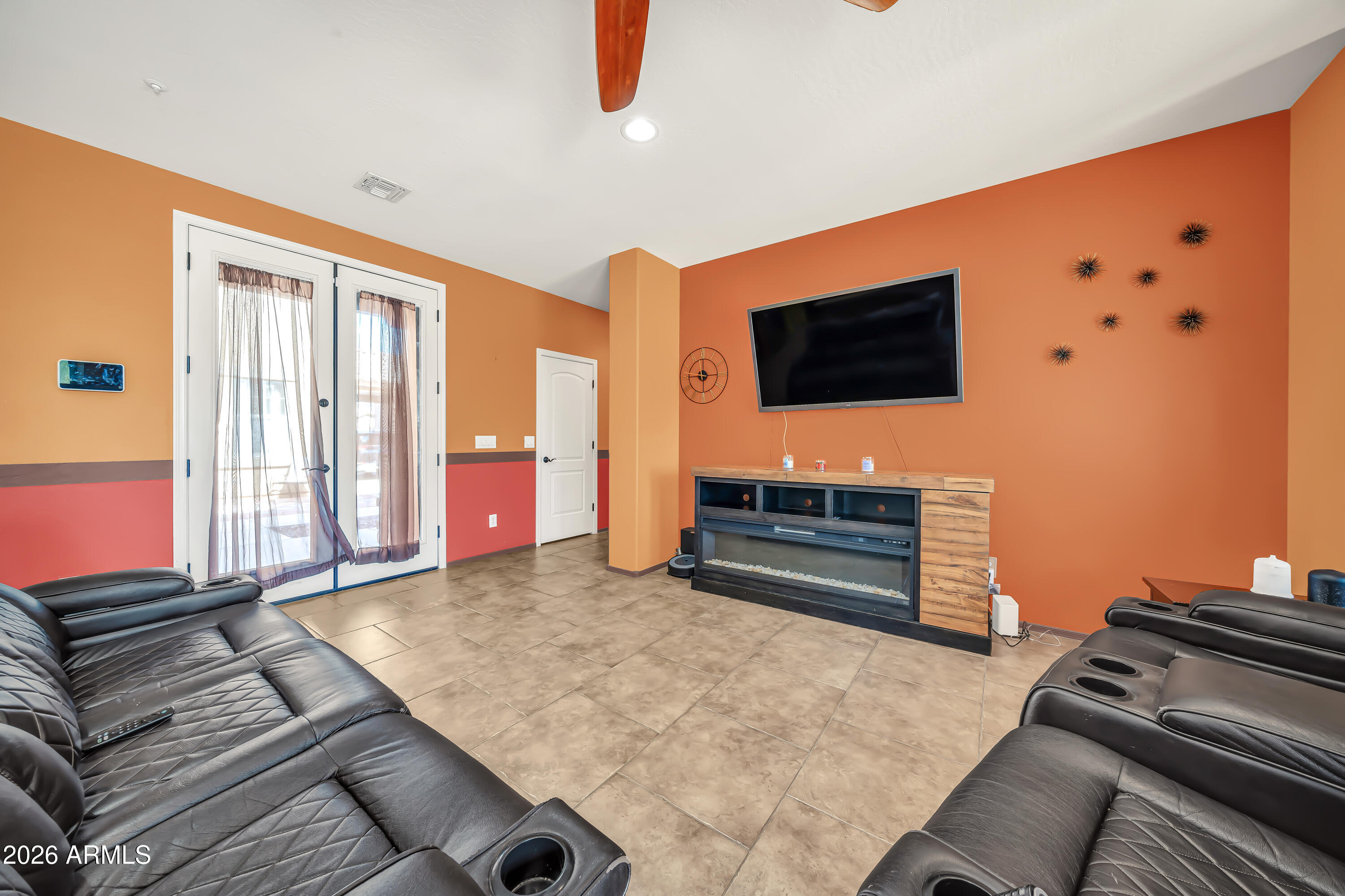 15327 West Roma Avenue Goodyear, AZ 85395 - Photo 14 of 65 a living room with furniture and a flat screen tv
