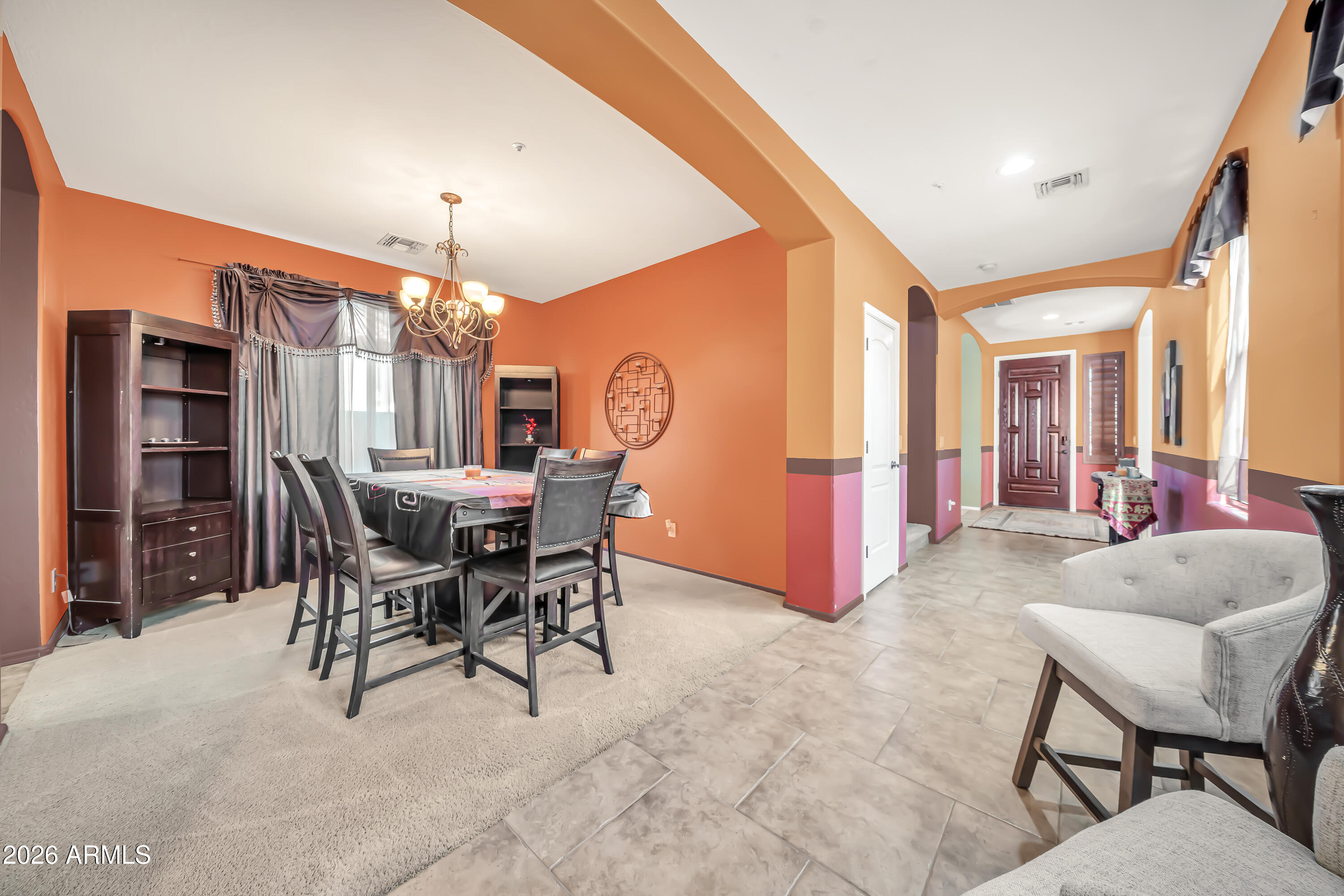 15327 West Roma Avenue Goodyear, AZ 85395 - Photo 18 of 65 a view of a livingroom with furniture and a large window