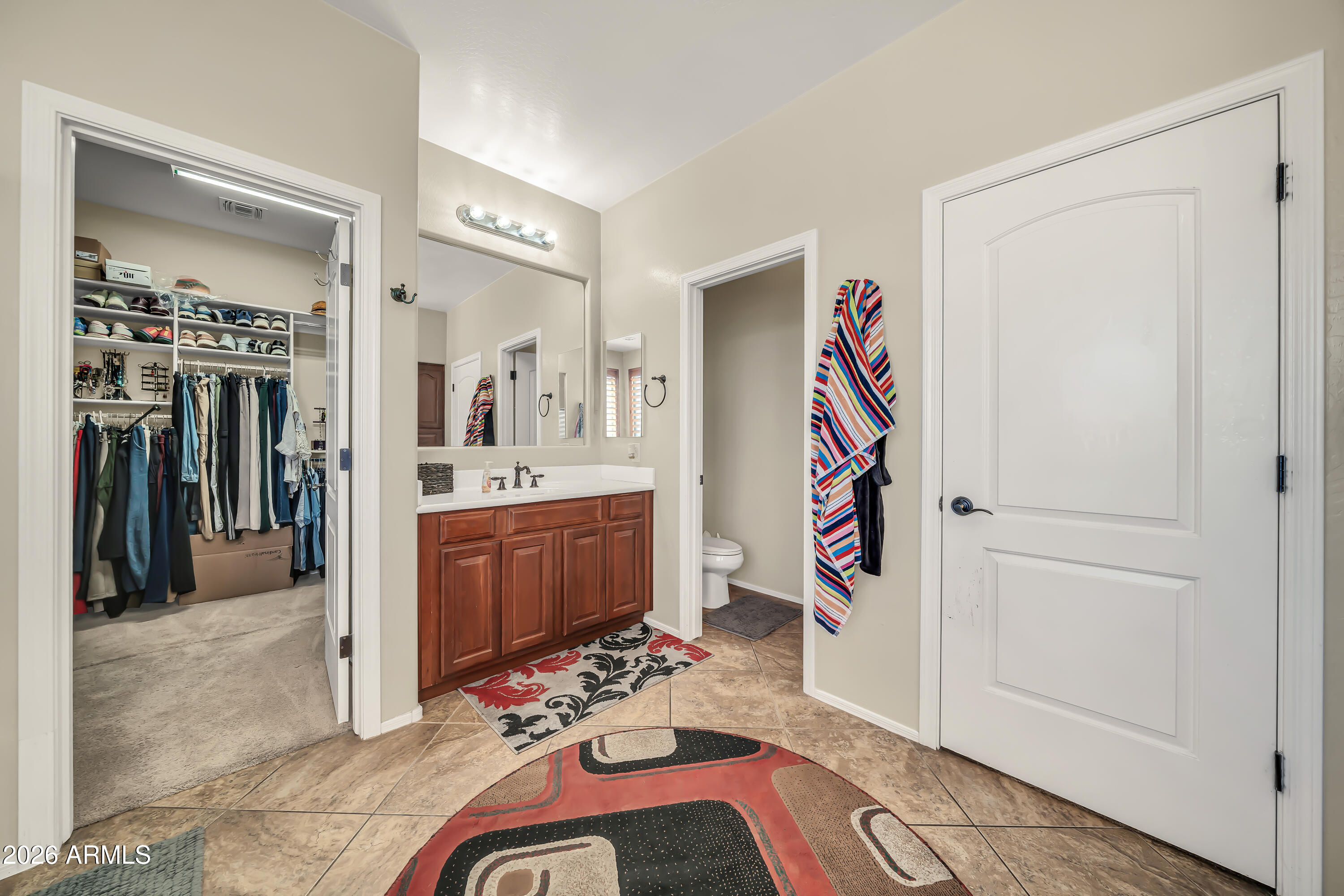 15327 West Roma Avenue Goodyear, AZ 85395 - Photo 26 of 65 a very nice looking room with a couch