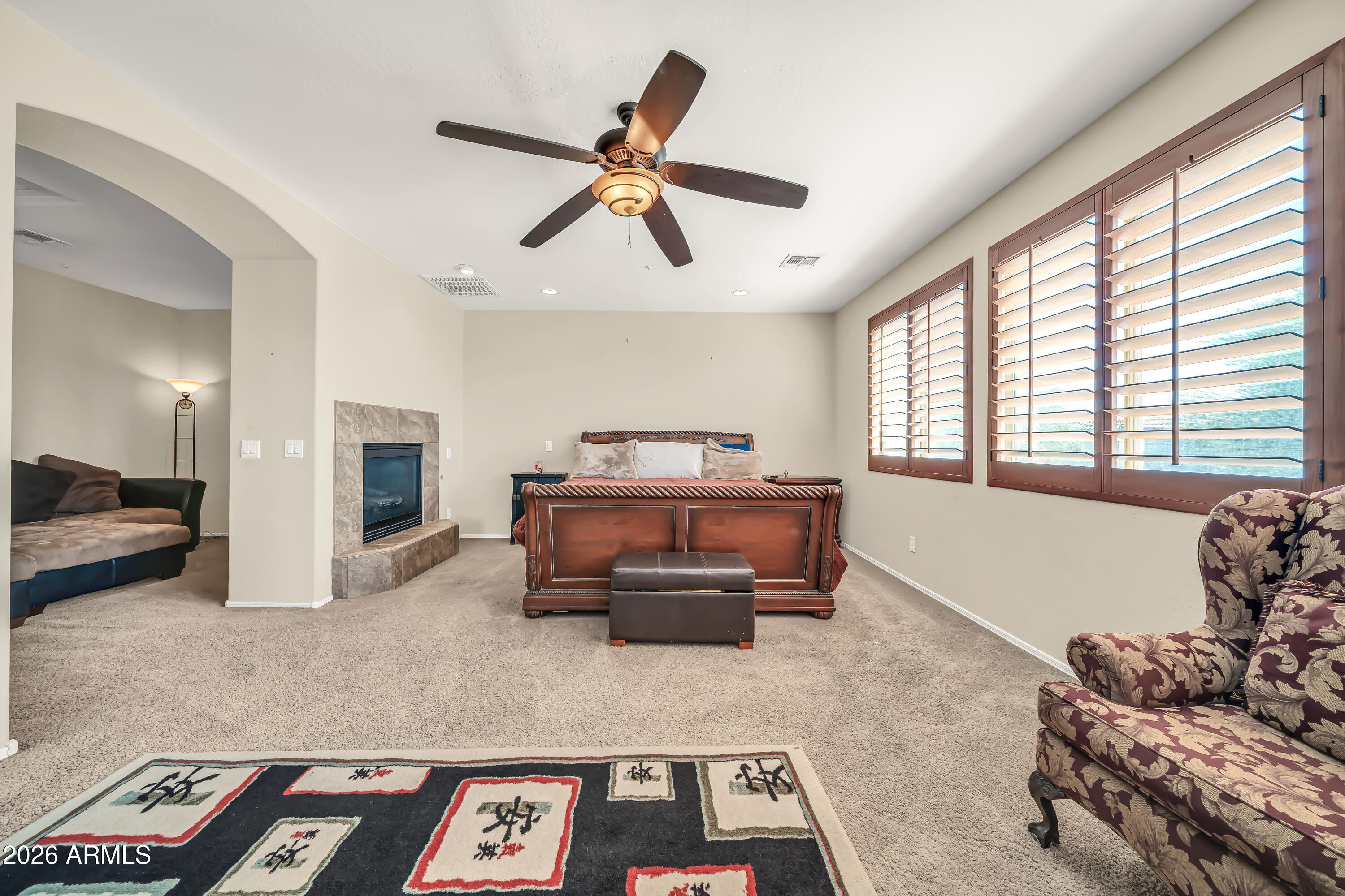 15327 West Roma Avenue Goodyear, AZ 85395 - Photo 28 of 65 a living room with furniture and a window