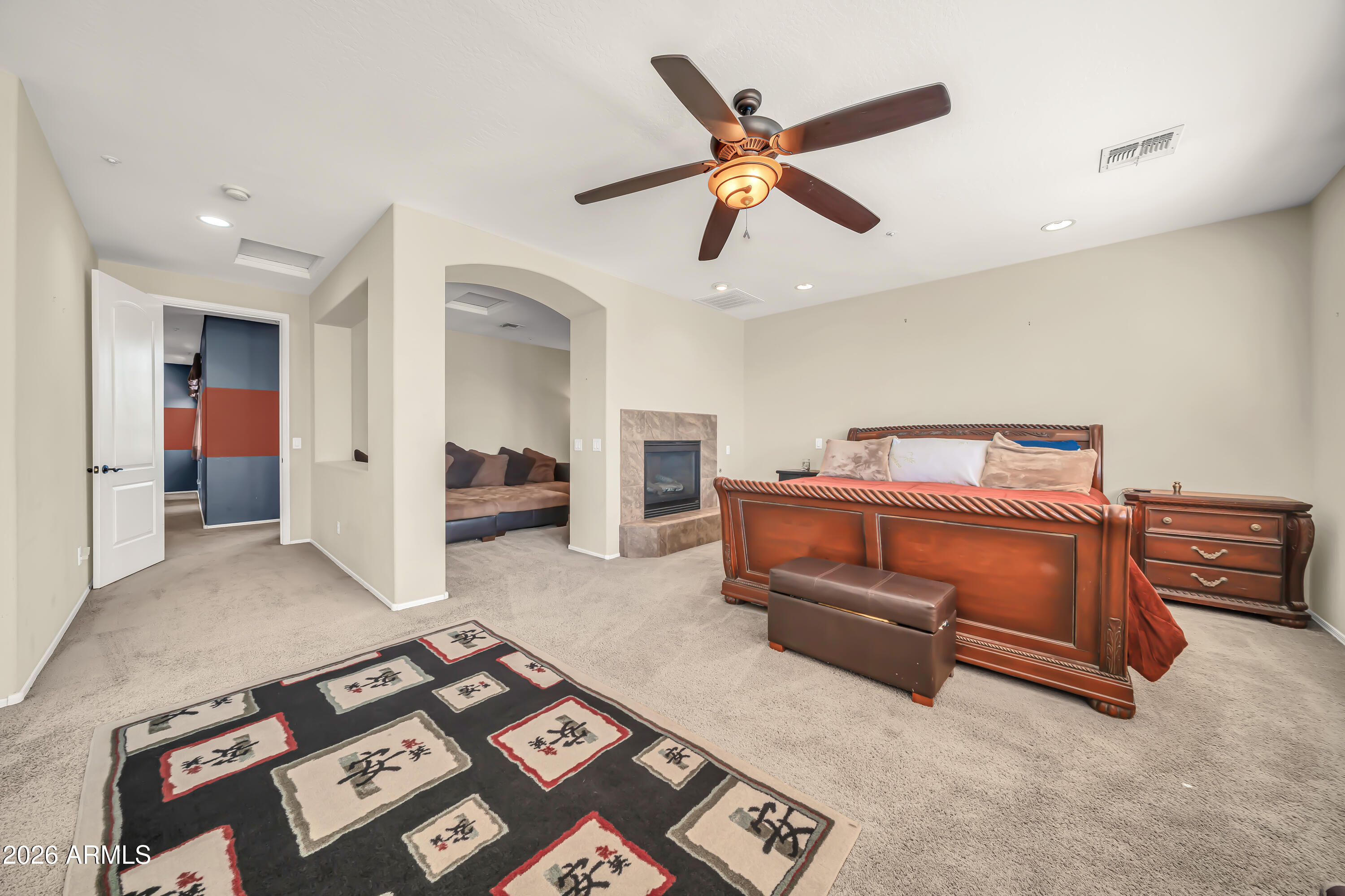 15327 West Roma Avenue Goodyear, AZ 85395 - Photo 29 of 65 a bedroom with furniture and a chandelier