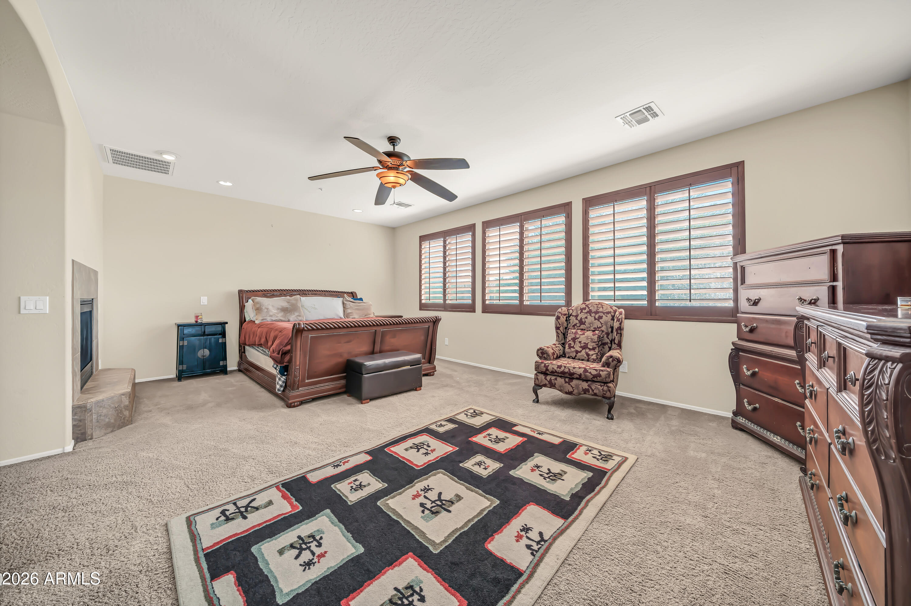 15327 West Roma Avenue Goodyear, AZ 85395 - Photo 30 of 65 a living room with furniture and a flat screen tv