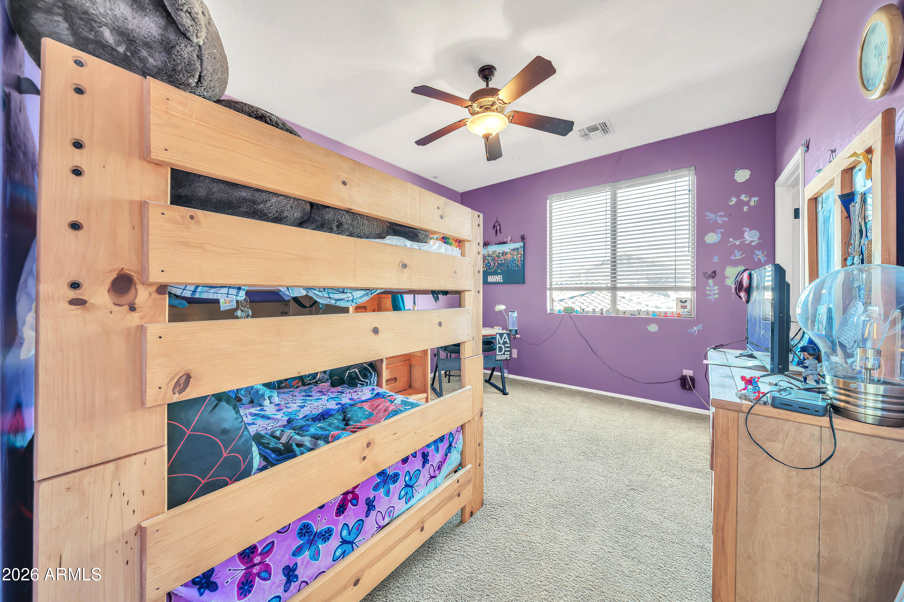 15327 West Roma Avenue Goodyear, AZ 85395 - Photo 37 of 65 a bedroom with a bed dresser and window