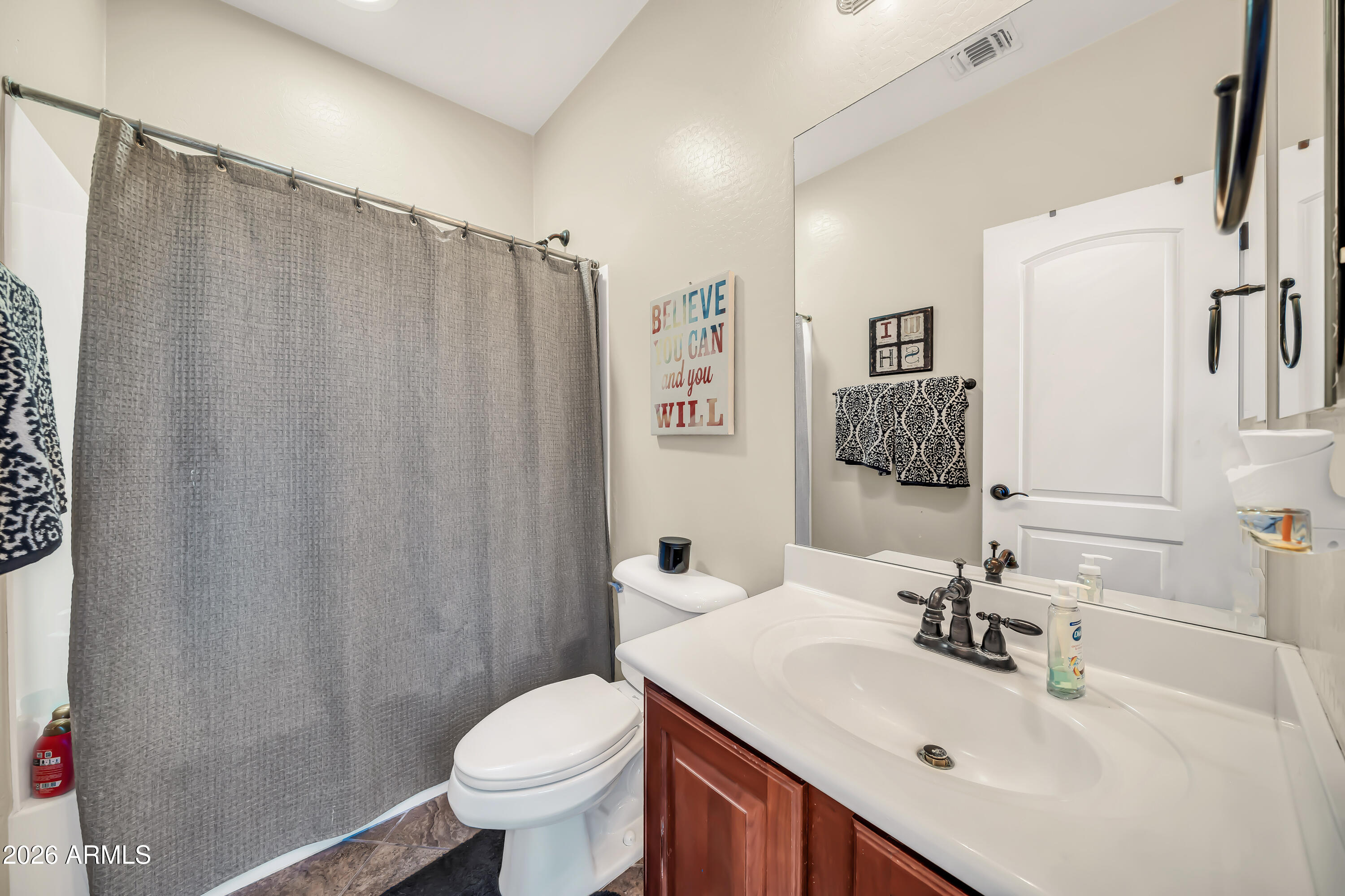 15327 West Roma Avenue Goodyear, AZ 85395 - Photo 38 of 65 a bathroom with a sink toilet and shower