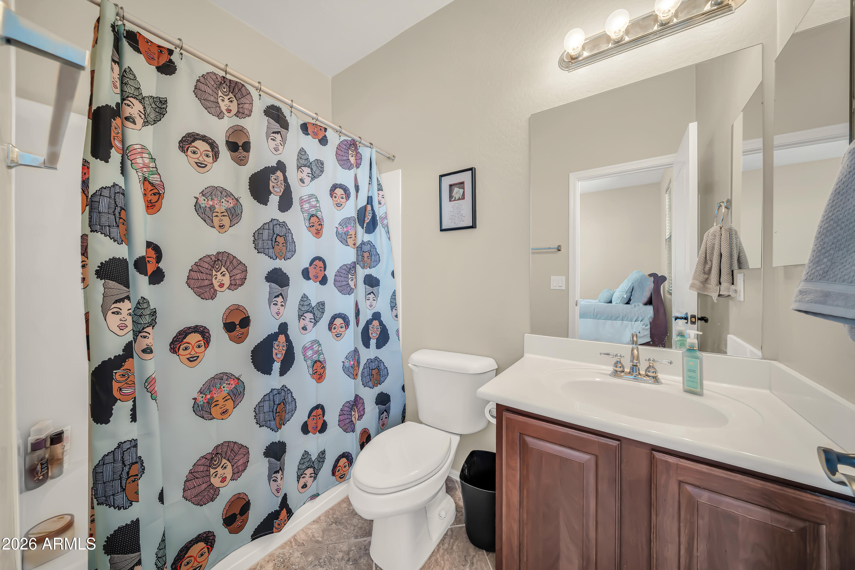 15327 West Roma Avenue Goodyear, AZ 85395 - Photo 39 of 65 a bathroom with a sink and a mirror