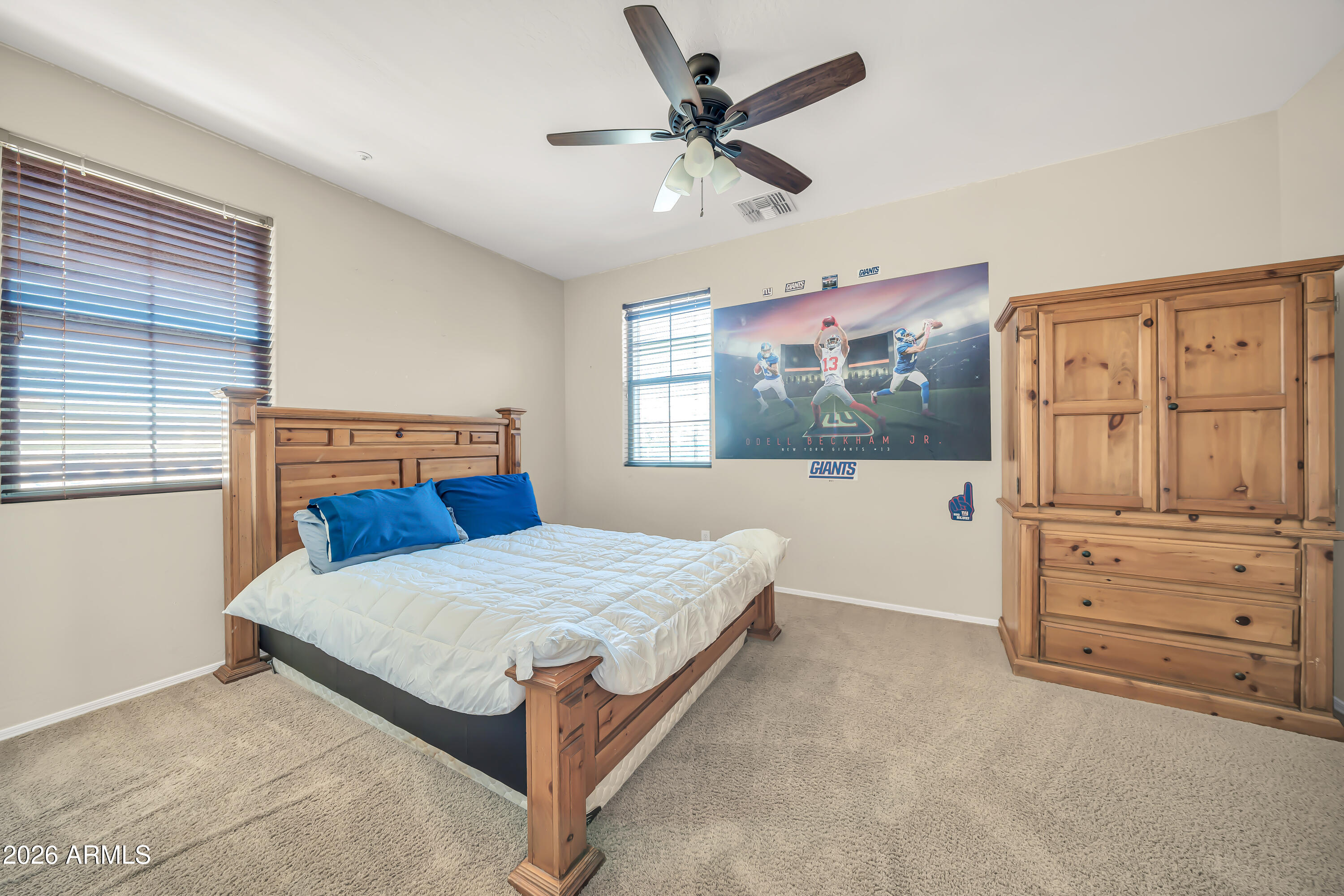 15327 West Roma Avenue Goodyear, AZ 85395 - Photo 43 of 65 a bedroom with a bed and window