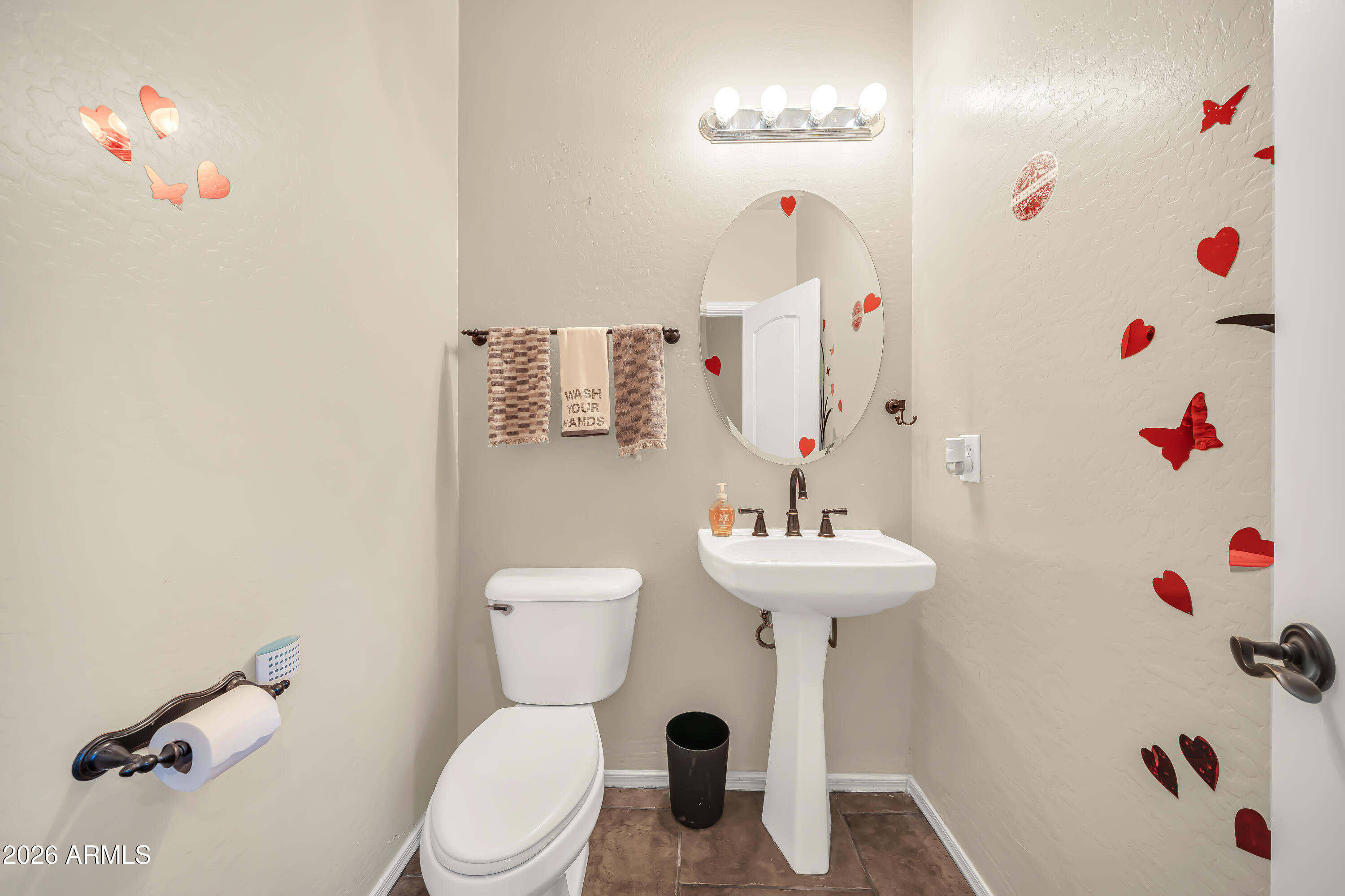 15327 West Roma Avenue Goodyear, AZ 85395 - Photo 44 of 65 a bathroom with a sink a toilet and a shower