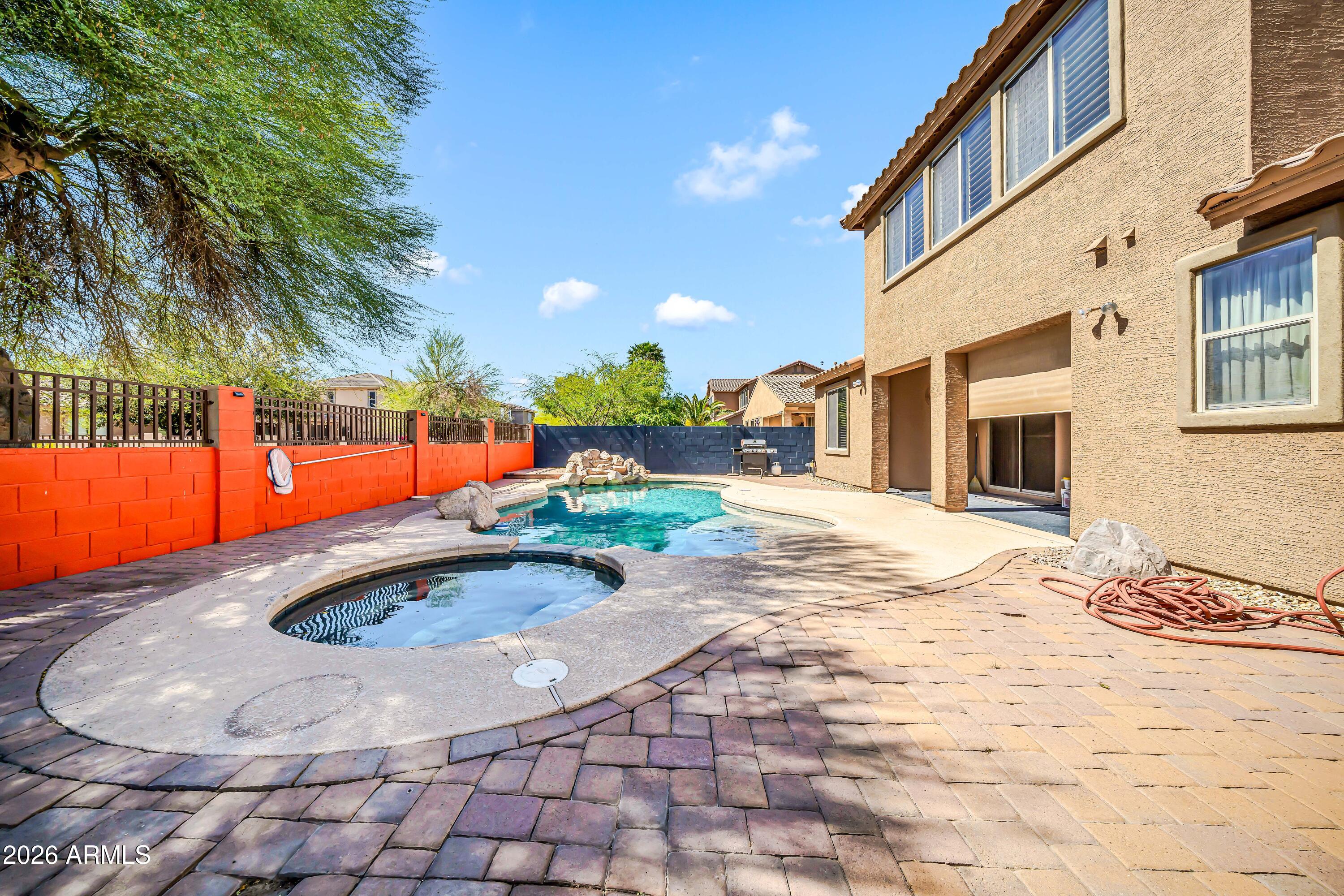 15327 West Roma Avenue Goodyear, AZ 85395 - Photo 57 of 65 a view of a house with a swimming pool