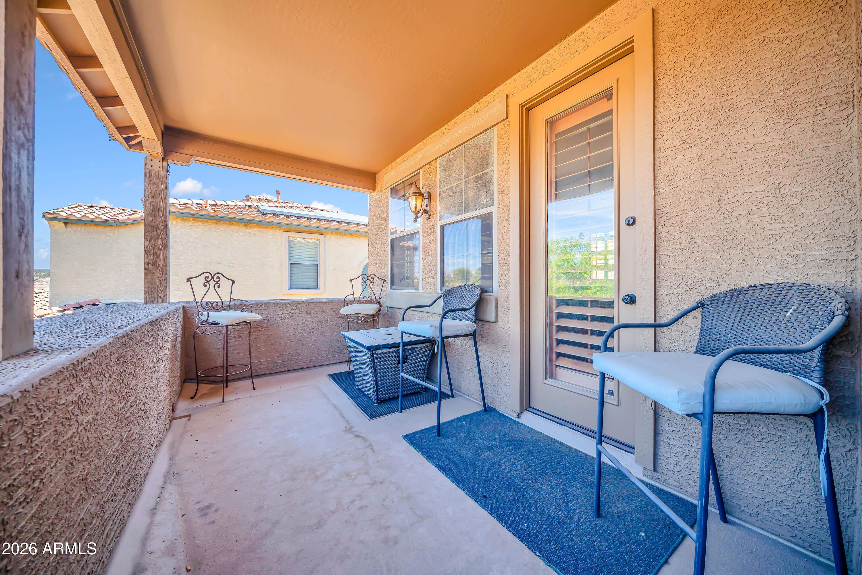 15327 West Roma Avenue Goodyear, AZ 85395 - Photo 62 of 65 a living room with furniture and a large window