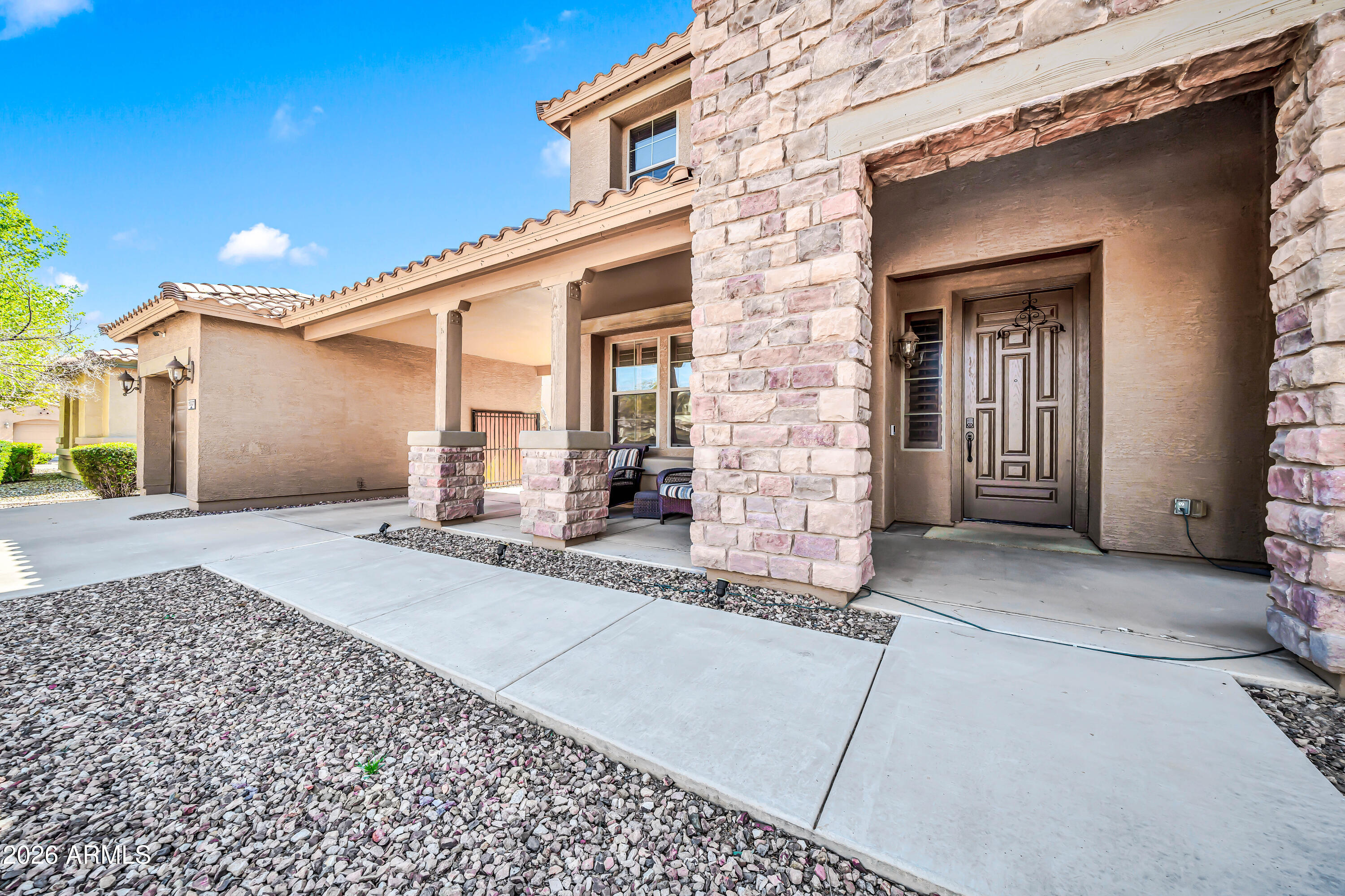 15327 West Roma Avenue Goodyear, AZ 85395 - Photo 4 of 65 a view of a house with a patio