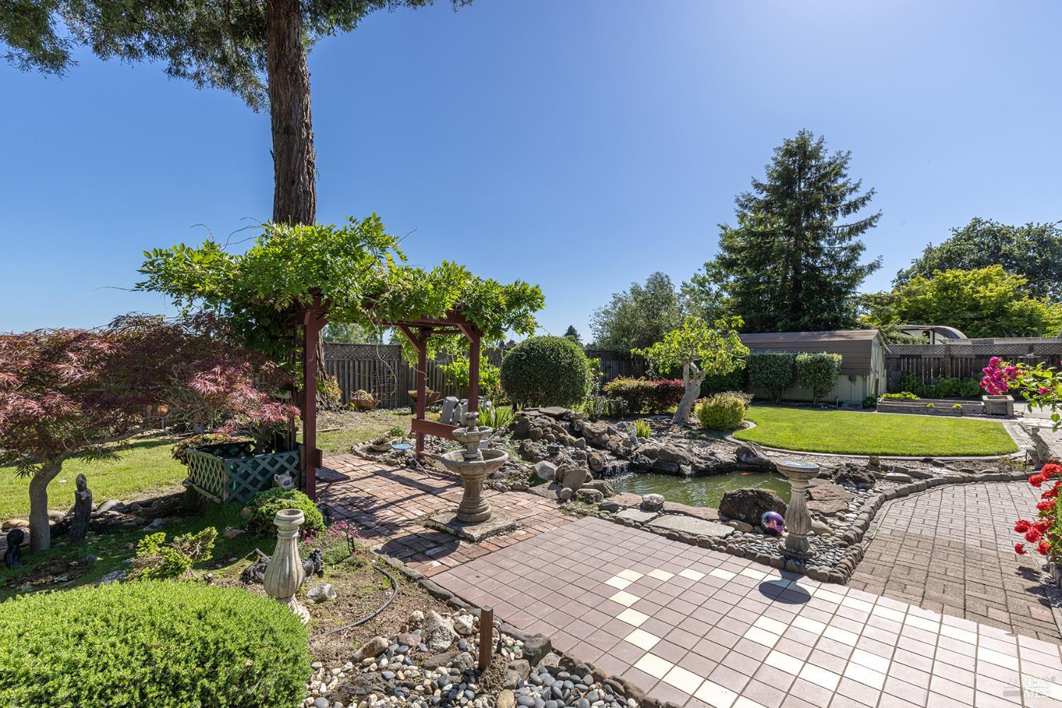 2236 West Hearn Avenue Santa Rosa, CA 95407 - Photo 45 of 56 a view of a swimming pool with lawn chairs under an umbrella