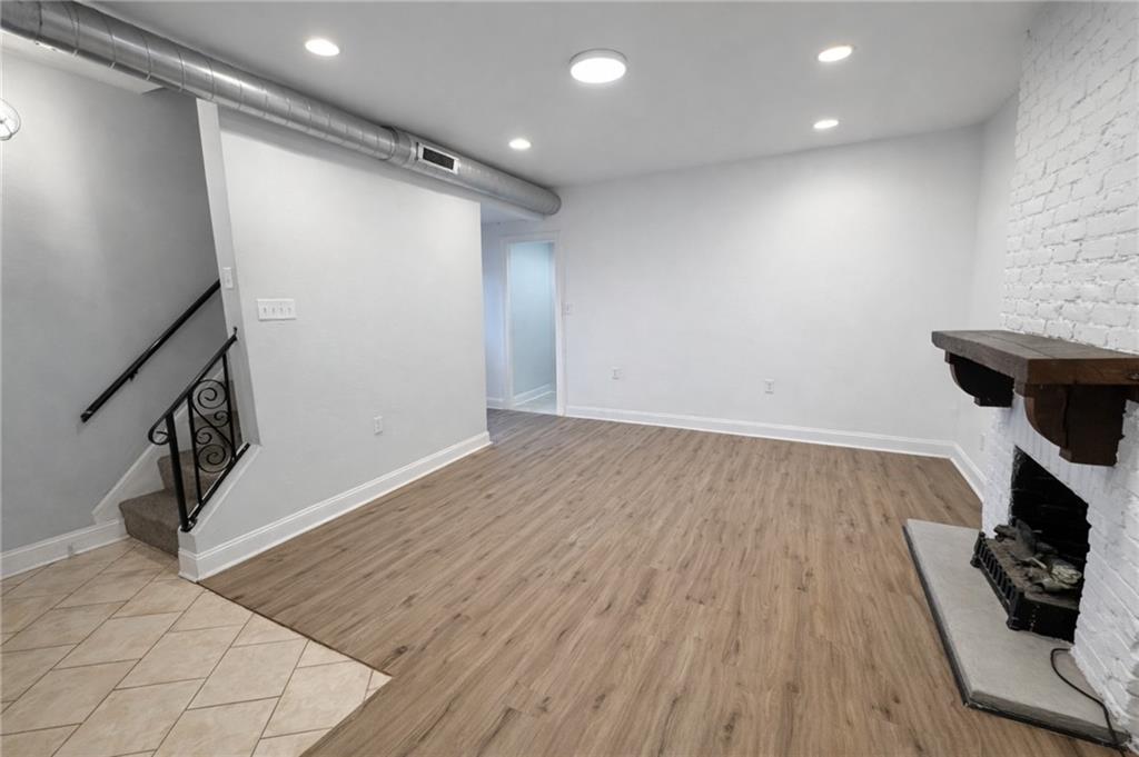 1921 Shamokin Street Pittsburgh, PA 15203 - Photo 1 of 10 a view of hallway with wooden floor and stairs