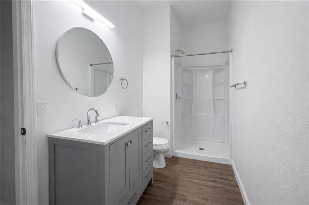 1921 Shamokin Street Pittsburgh, PA 15203 - Photo 6 of 10 a bathroom with a sink and a mirror