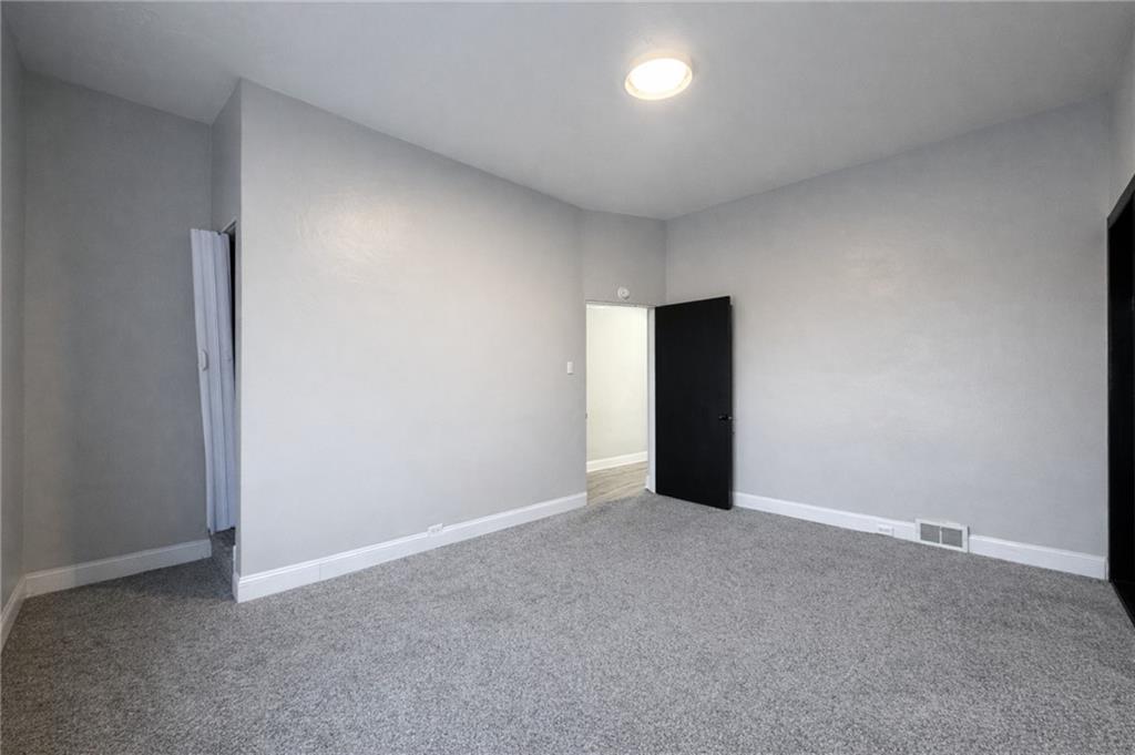 1921 Shamokin Street Pittsburgh, PA 15203 - Photo 7 of 10 a view of an empty room with wooden floor