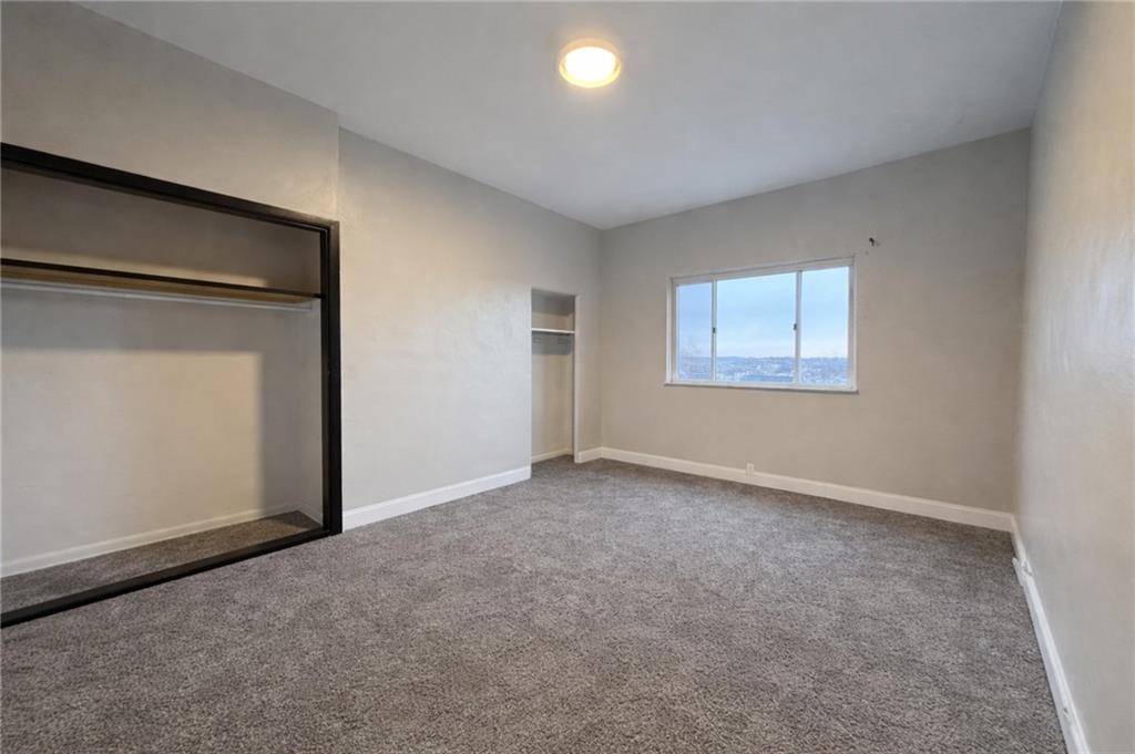 1921 Shamokin Street Pittsburgh, PA 15203 - Photo 8 of 10 an empty room with windows