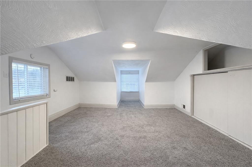 1921 Shamokin Street Pittsburgh, PA 15203 - Photo 9 of 10 an empty room with windows and pillars in it