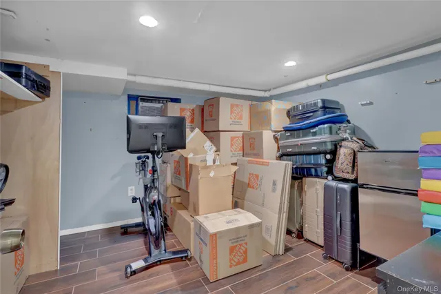 a room with furniture a rug and gym equipment