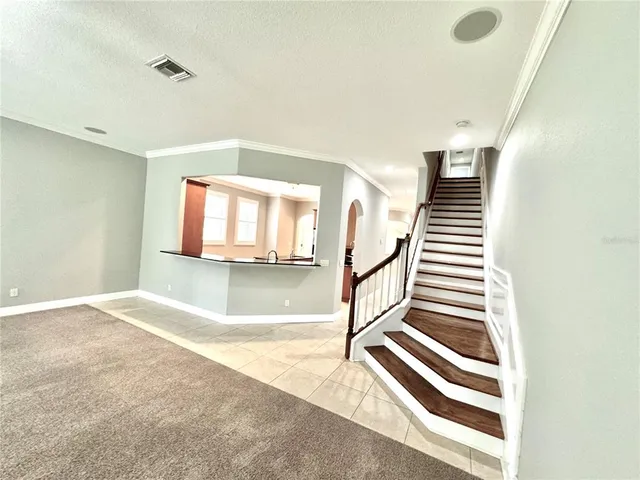 a view of a hallway with staircase