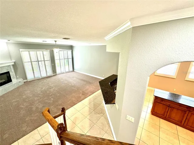 a bathroom with a granite countertop sink mirror and bathtub