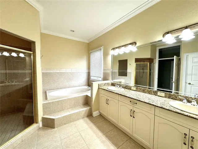 a bathroom with a bathtub and a window
