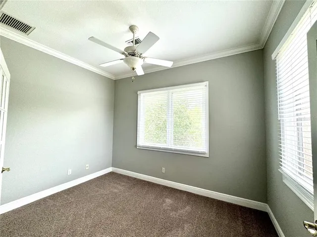 a view of an empty room with a fireplace