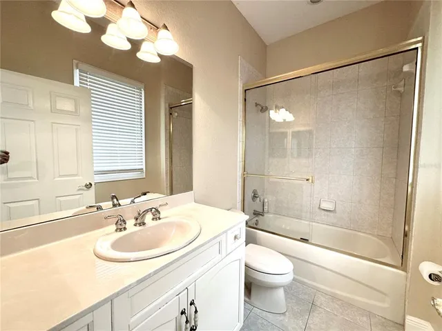 an empty room with a empty space and windows