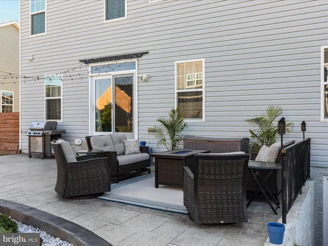 an outdoor space with swimming pool and furniture