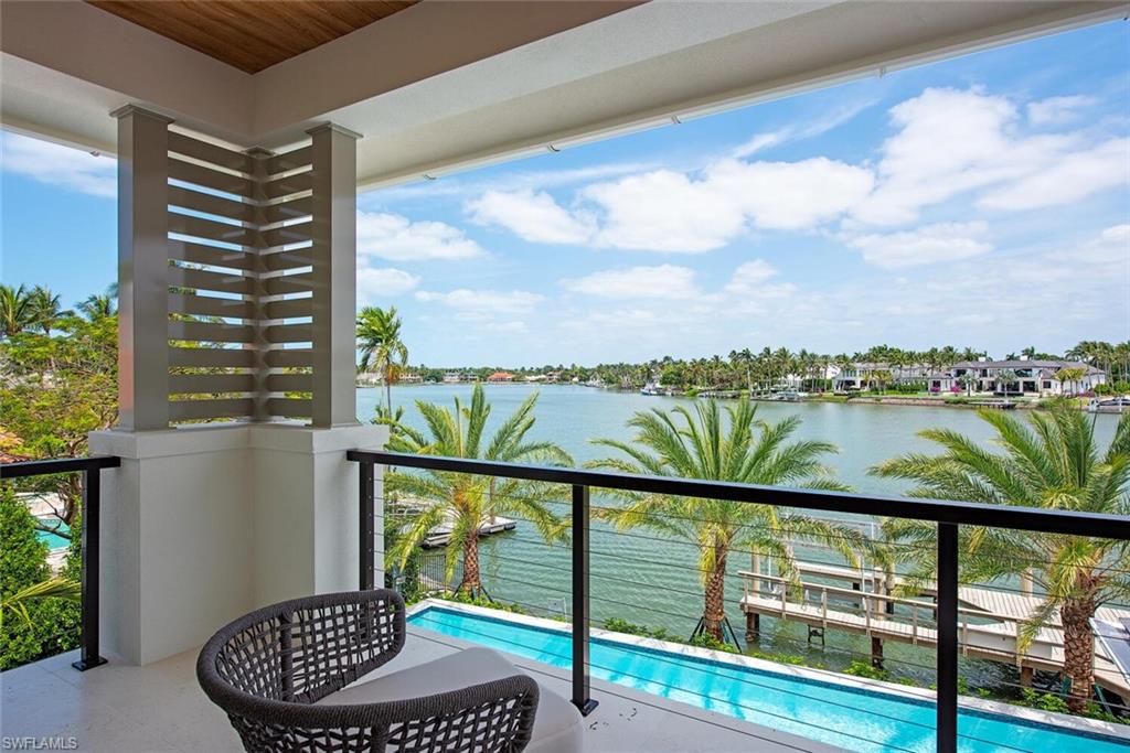 2999 Rum Row Naples, FL 34102 - Photo 25 of 33 Balcony with a water view