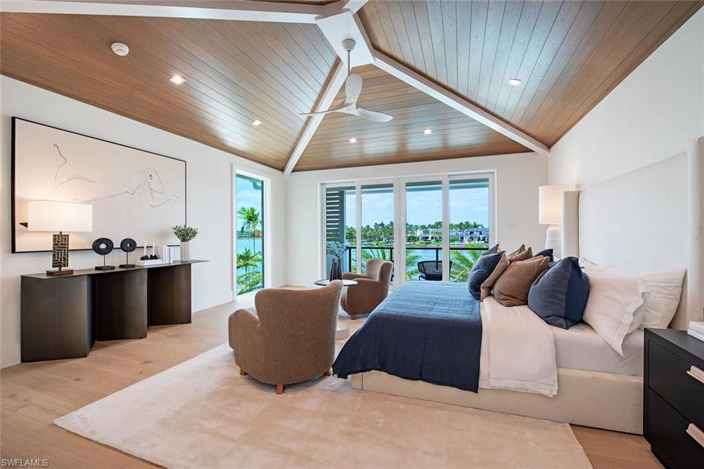 2999 Rum Row Naples, FL 34102 - Photo 26 of 33 Bedroom featuring light wood-style flooring, recessed lighting, lofted ceiling, access to outside, and wooden ceiling