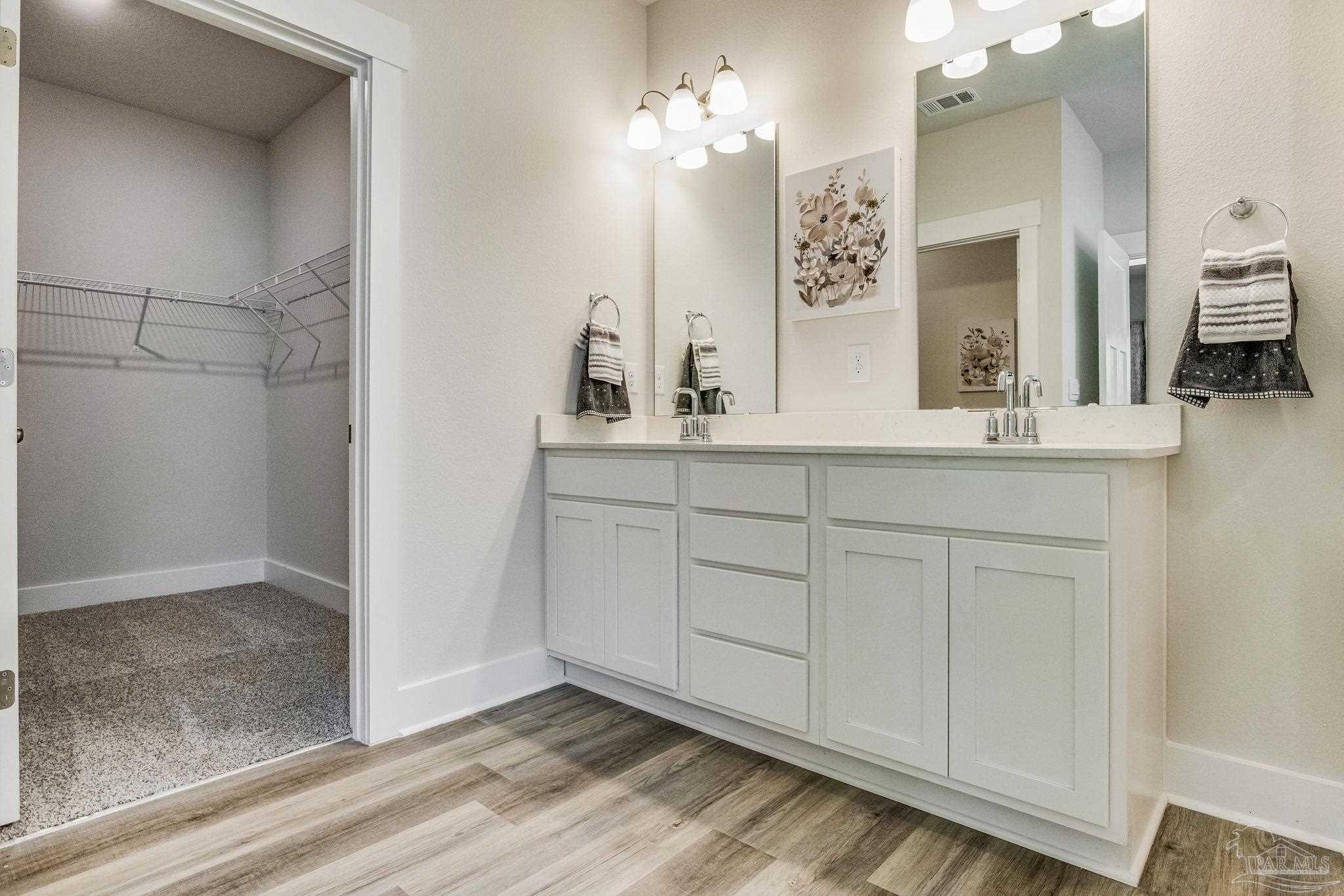 3238 Grouse Road Pace, FL 32571 - Photo 18 of 50 a bathroom with a sink and a mirror