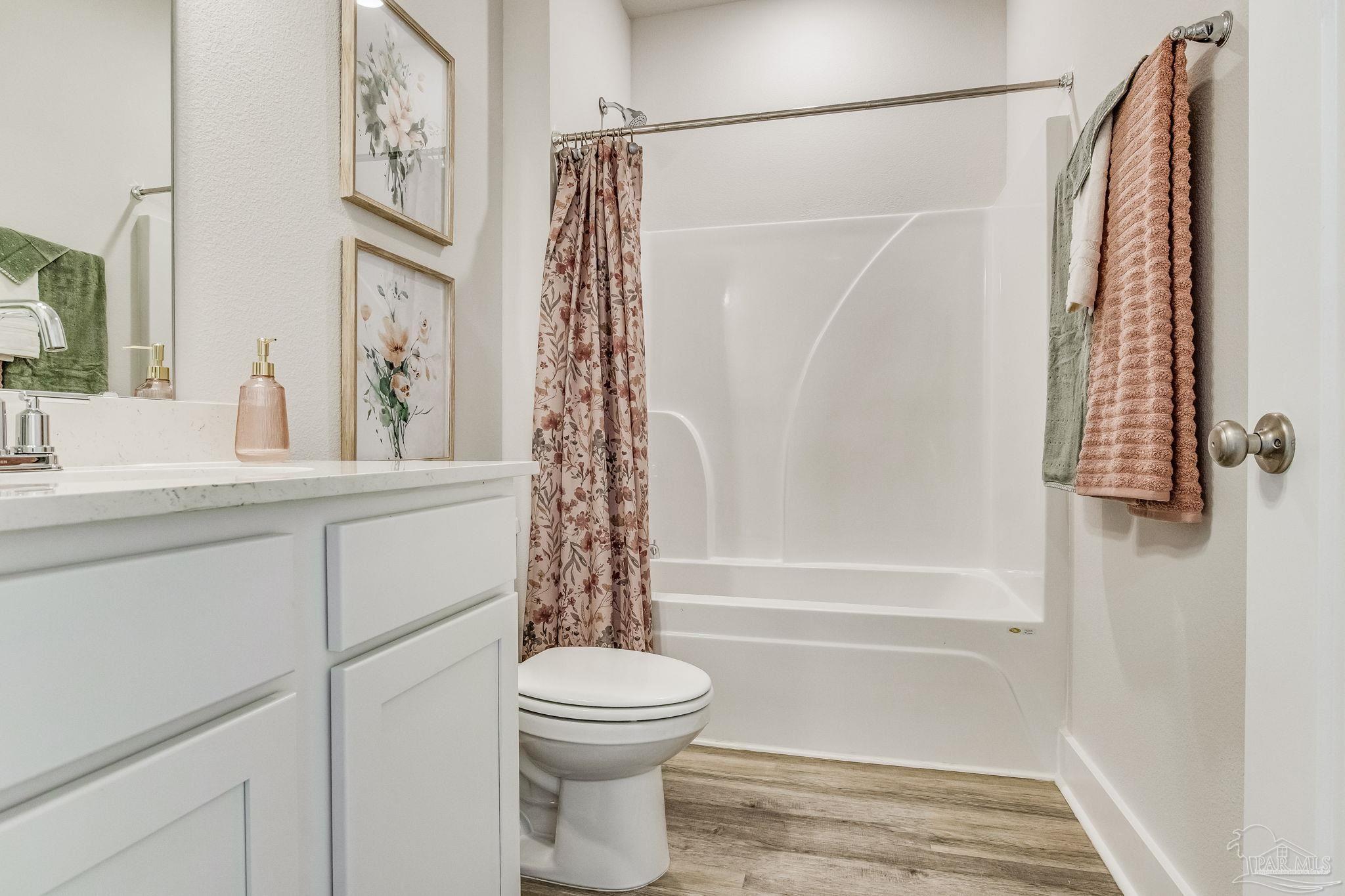3238 Grouse Road Pace, FL 32571 - Photo 27 of 50 a bathroom with a toilet sink and shower