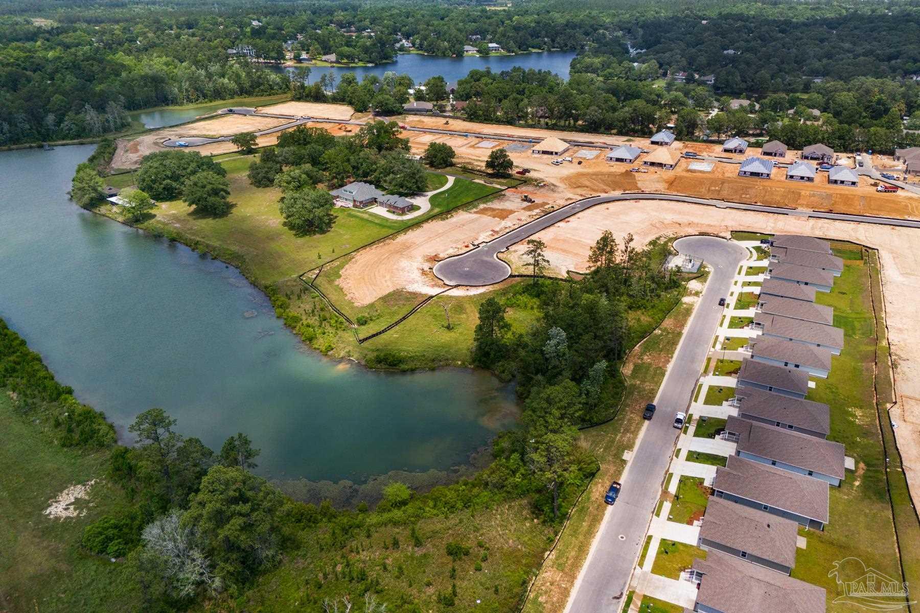 3238 Grouse Road Pace, FL 32571 - Photo 50 of 50 an aerial view of residential houses with outdoor space and swimming pool